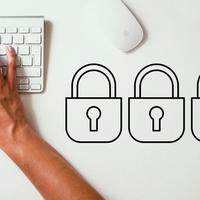 typing on keyboard with graphic art padlocks